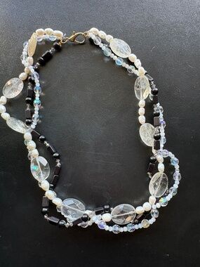 Multi-strand pearl, crystal, and black bead necklace